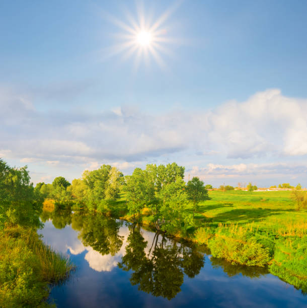 istock small calm river at the sunny day, summer countryside landscape 2148355306