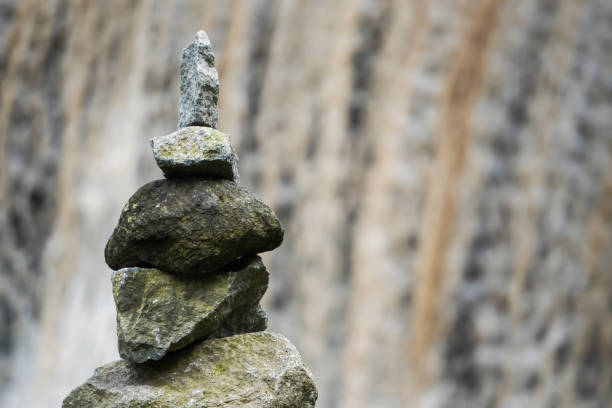 istock Stone tower on waterfall stream background. Rock Balancing or rock stacking hobby in the nature. Empty blank copy text space. 2148355723