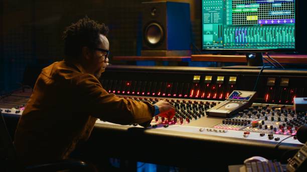 istock African american audio expert adding sound effects on tracks in post production 2148355841