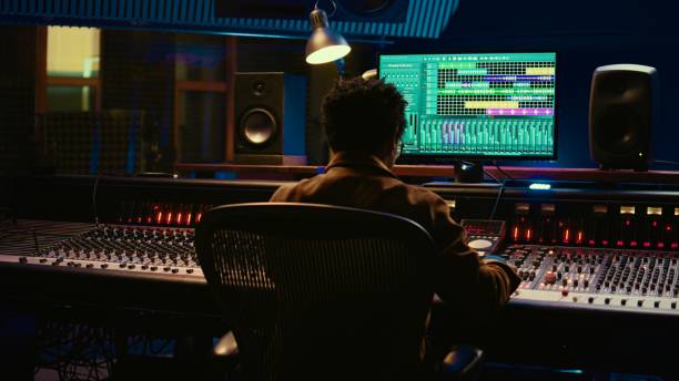 istock African american sound producer editing tracks on audio software and console 2148356223