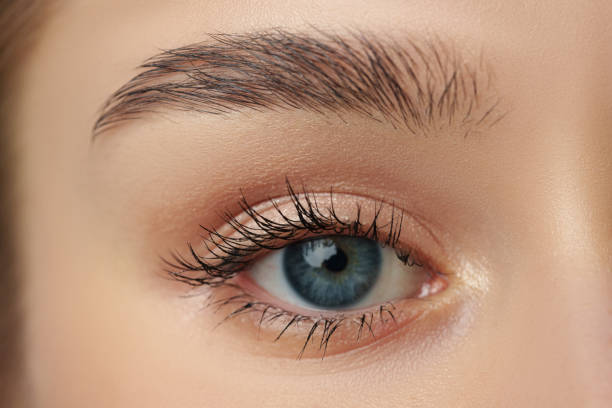 istock Close Up of Womans Face With Blue Eyes 2148356284
