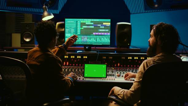istock Professional engineer and musician mixing tracks next to isolated display 2148356297