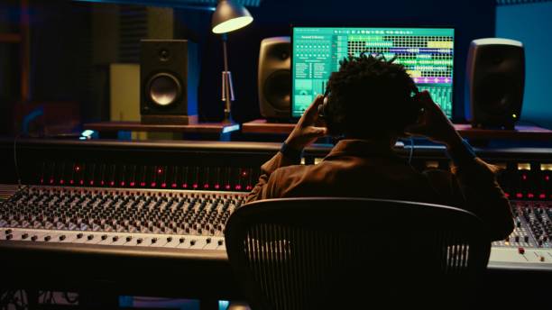 istock African american sound engineer recording and editing tracks in post production 2148356328