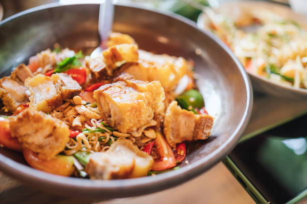 Variety esan food somtum deep fired pork tom yum soup and larb in local thai restaurant