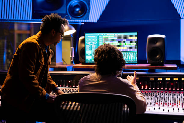 istock Team of audio engineer and musician producing and editing tracks 2148356986