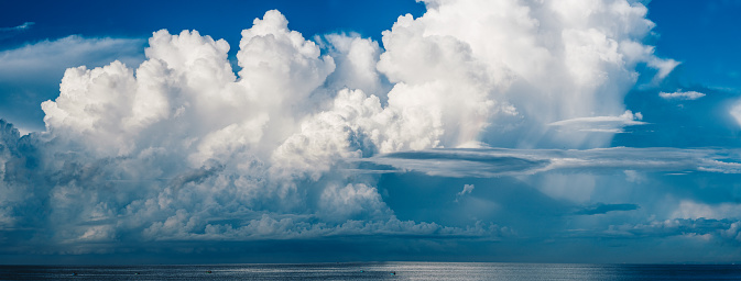 Fantastically beautiful huge clouds panorama sea, magical mood, lightness, joy, happiness, freedom.