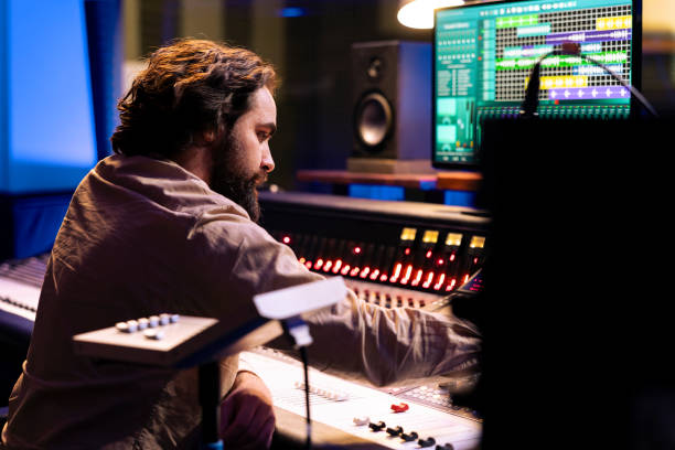 istock Audio technician working on recording and editing new music in studio 2148357463