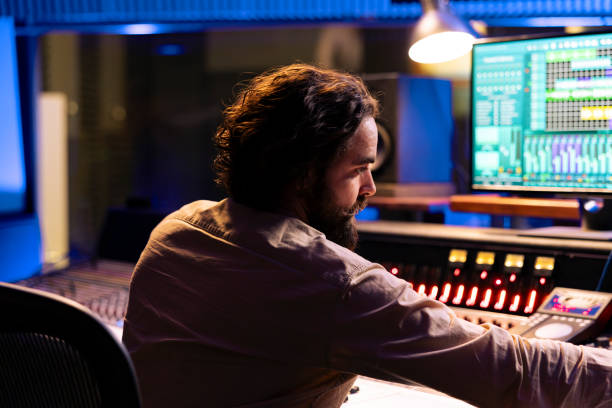 istock Sound technician producing new music with mixing console 2148357515