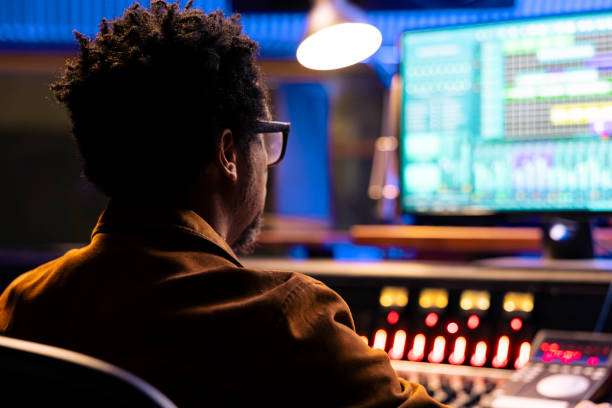 istock African american record producer mixing and mastering tracks with software 2148357747