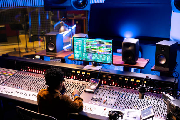 istock African american audio expert editing tunes with digital software on pc 2148357765