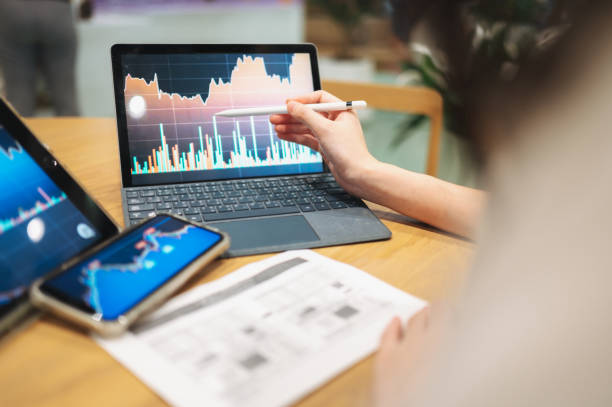 istock GenZ Investor trading making interacting with AI automated system with chart analysis big data stockmarket selected best stock with data 2148357780