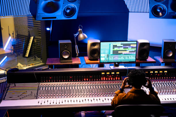 istock African american sound designer editing records in professional studio 2148357781