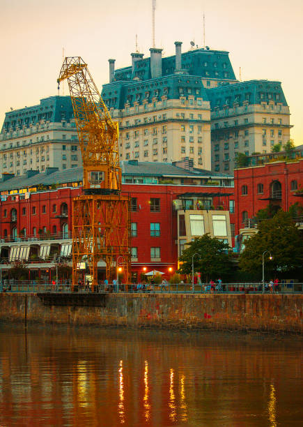Splendor at Sunset: Puerto Madero, Buenos Aires, Argentina, Basks in the Glow of Dusk, Revealing its Elegance and Charm as One of the City's Most Sophisticated Neighborhoods.
