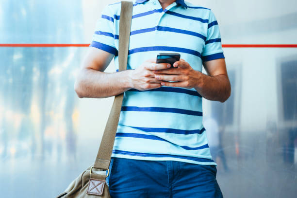 istock Handsome man typing mobile phone at the street. Communication concept 2148360081