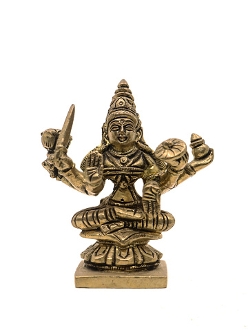 vintage metal figure of hindu goddess mahalakshmi in detail sitting cross legged isolated in a white background