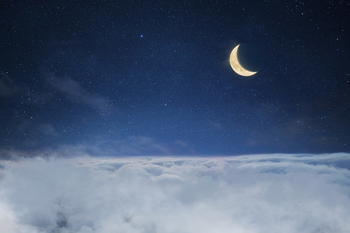 Clouds with starry sky and crescent moon, creative idea. Sleep and dreams, concept. Good night.