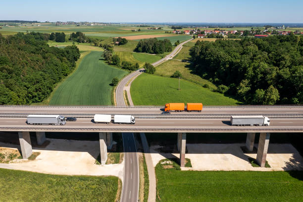 istock Trucks on rural highway, aerial view 2148361883