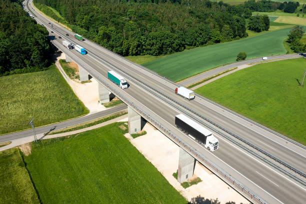 istock Rural highway with trucks, aerial view 2148362493