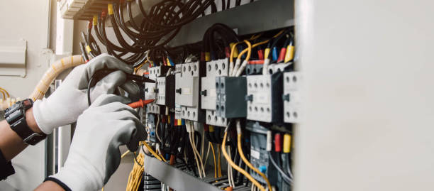istock Electrician engineer tests electrical installations and wires on relay protection system. 2148363184