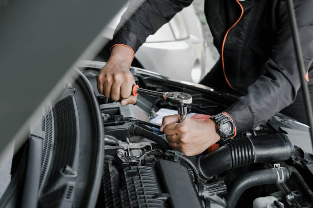 istock Mechanic fixing a car at home. Repair and service. 2148363198
