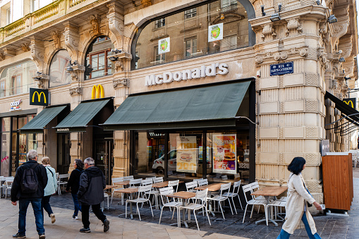 Bordeaux, France - April 8th, 2024:  McDonald's Restaurant in a busy city street of Bordeaux, France