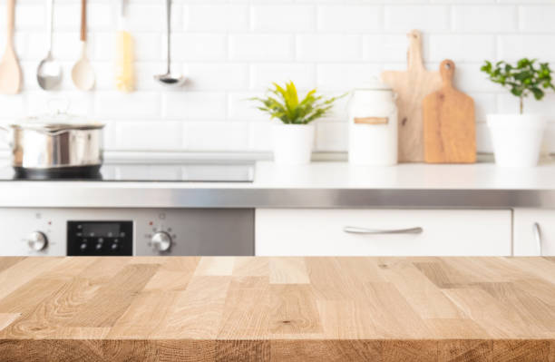 istock Wood table top on blur kitchen room counter background for product display 2148365430
