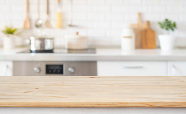 istock Empty wood table top for product montage on blur modern kitchen counter background 2148365442