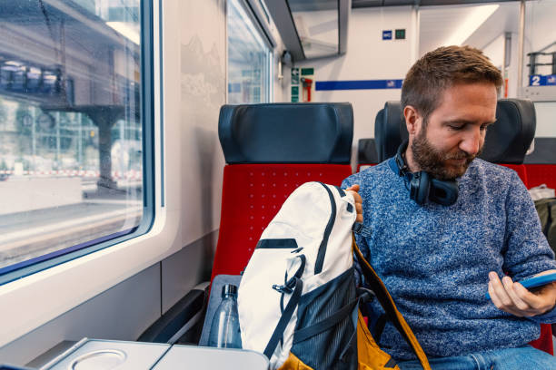 istock Commuter with Smartphone and Headphones on Train 2148365525