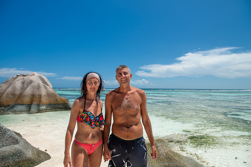 A caucasian couple enjoying life at La Digue Island in the Seychelles Archipelago.