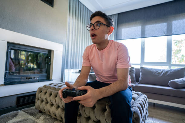 istock joystick is in teenage boy hand for computer game focus on foreground horizontal still 2148366860