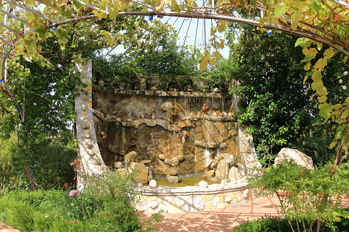 a stone wall water tap in albania