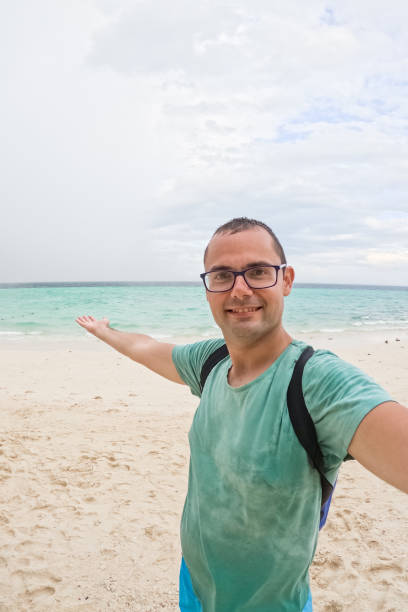 istock Young Man Taking Selfies On The Beach In Thailand 2148367687
