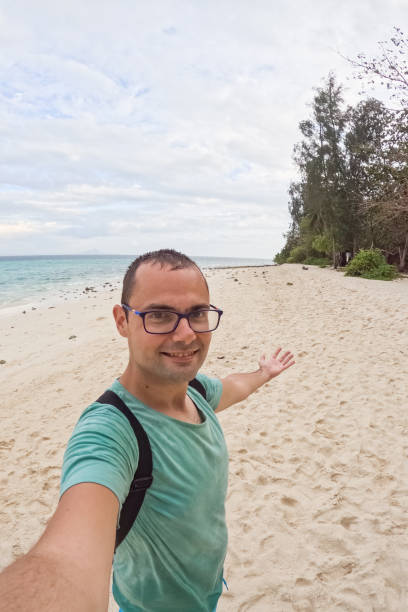 istock Young Man Taking Selfies On The Beach In Thailand 2148367704