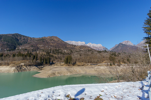 Reservoir lake during winter time in the mountain landscape of the Alps, Barcis, Friuli-Venezia Giulia, Italy