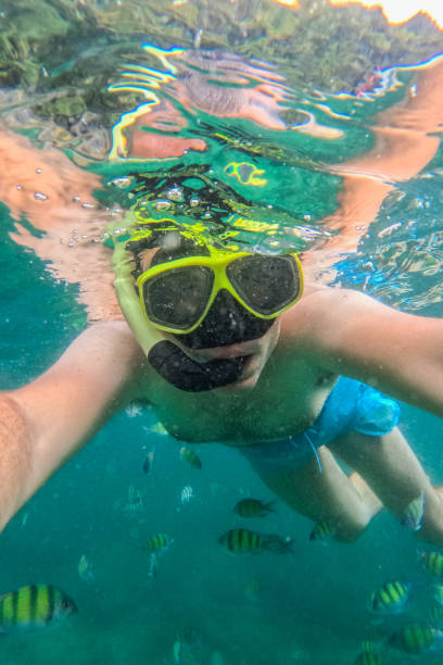 istock Young Man Taking Selfies While Snorkeling In The Sea In Thailand 2148367784