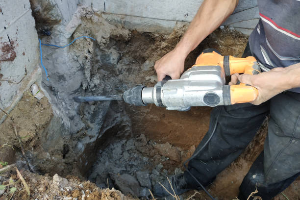 istock jackhammer in action, pneumatic construction tool, drilling a hole in the concrete wall. 2148368977