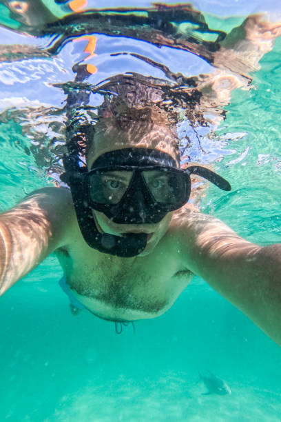 istock Young Man Taking Selfies While Snorkeling In The Sea At The Phi Phi Islands In Thailand 2148369002