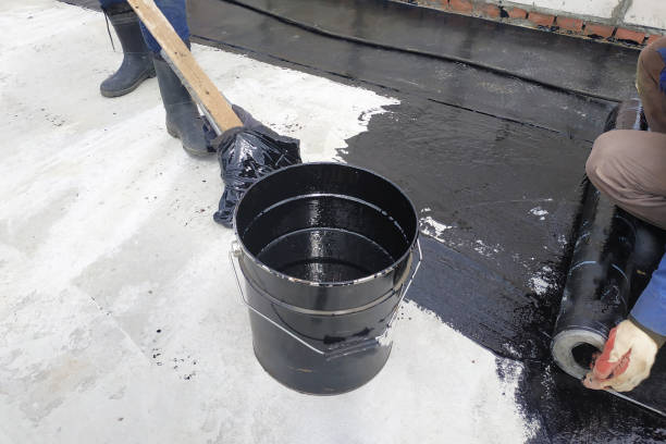 istock Masters perform work on the waterproofing of concrete in the open air. 2148369261