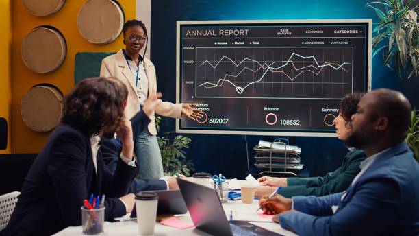 istock Marketing assistant presenting infographics in a status update meeting 2148369743