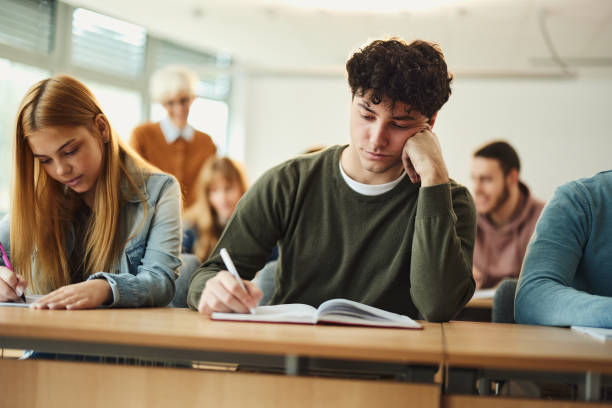 istock High school students writing an exam in the classroom. 2148370685