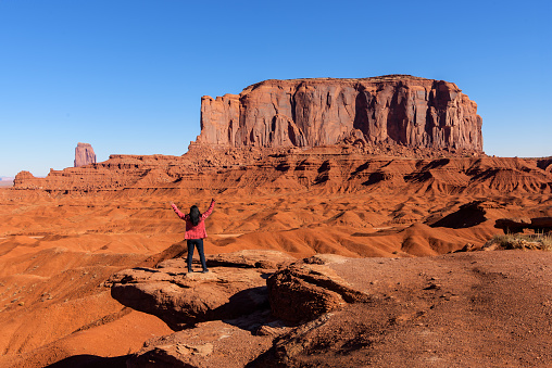 A tourist woman travels in Monument Valley in USA . Utah/Arizona, USA