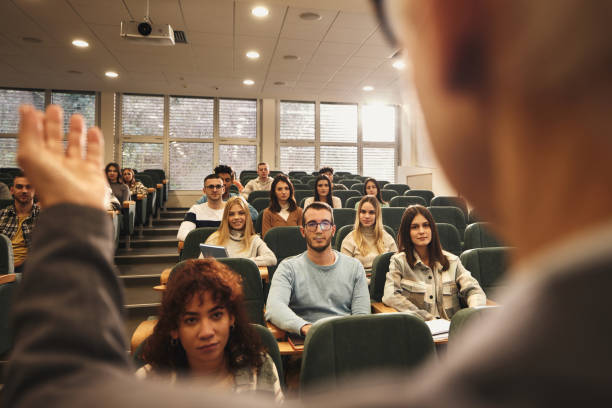 istock College students attending a lecture in amphitheater. 2148371241