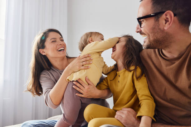 istock Happy family having fun in bedroom. 2148372169