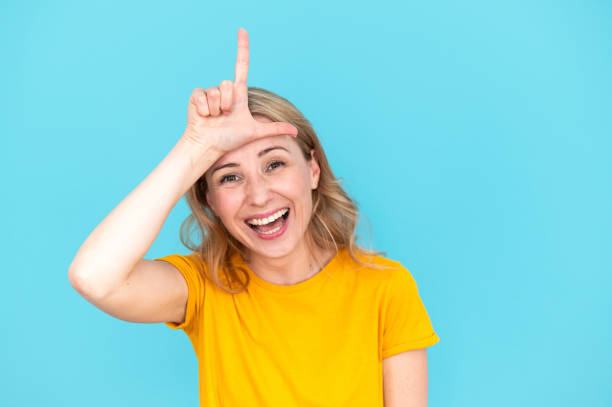 istock Playful female doing funny and comic face, fooling, enjoying joke 2148373138