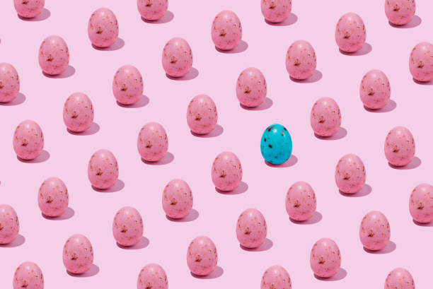 istock Pattern of pink shiny Easter egg casting shadow on pink background, minimalism concept 2148374635