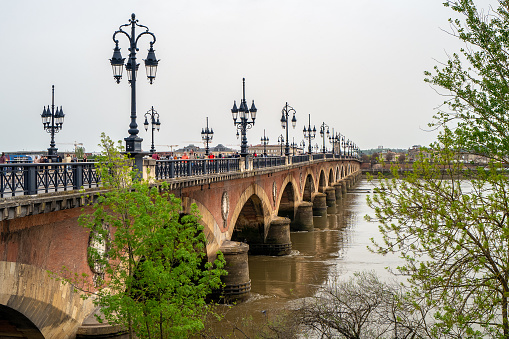Bordeaux, France - April 7th, 2024: The Pont de pierre bridge in Bordeaux