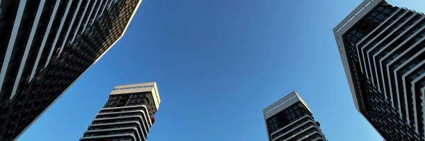 istock A sleek urban skyline, dominated by towering skyscrapers against a blue sky, symbolizing modernity and business. 2148377035