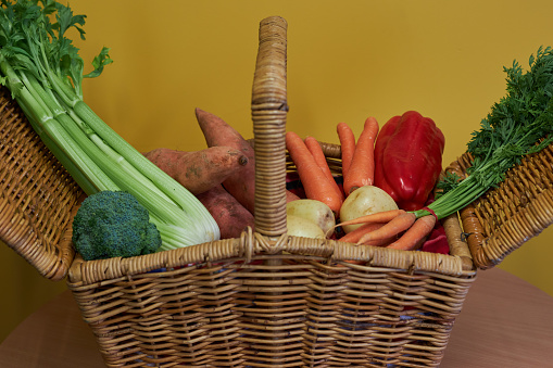 Vegetables including carrot, celery, broccoli, sweet potato, yams, onions, potatoes, capsicum, and red bell peppers. Colorful and healthy food, meeting dietary guidelines and health eating.