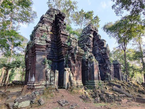 Prasat Chrap, a temple comprising 3 damaged towers built of laterite at Koh Ker, a remote archaeological site in northern Cambodia about 120 kilometres from the ancient site of Angkor.