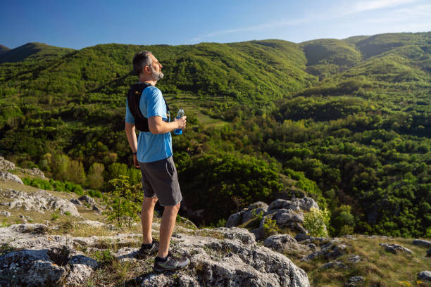 istock Trail runner at the top of the mountain 2148378994